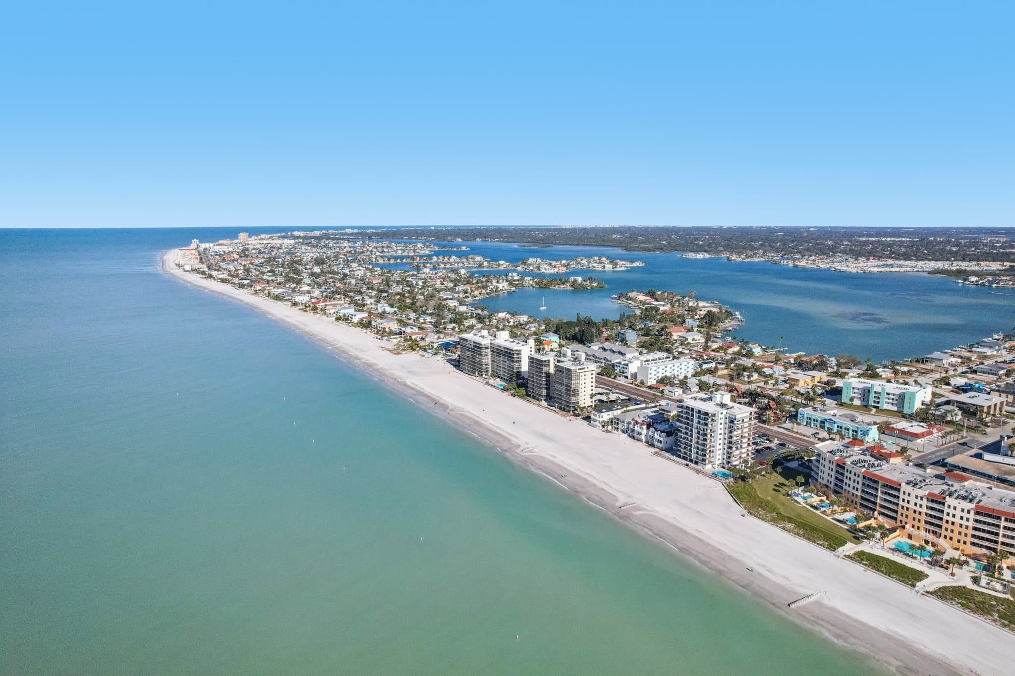 Aerial view of Madeira Beach Florida coastline with beachfront condos and Gulf of Mexico shoreline near 15316 Gulf Blvd