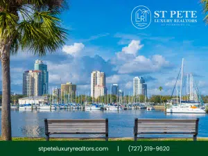 St. Petersburg waterfront with palm trees, yachts, and city skyline.
